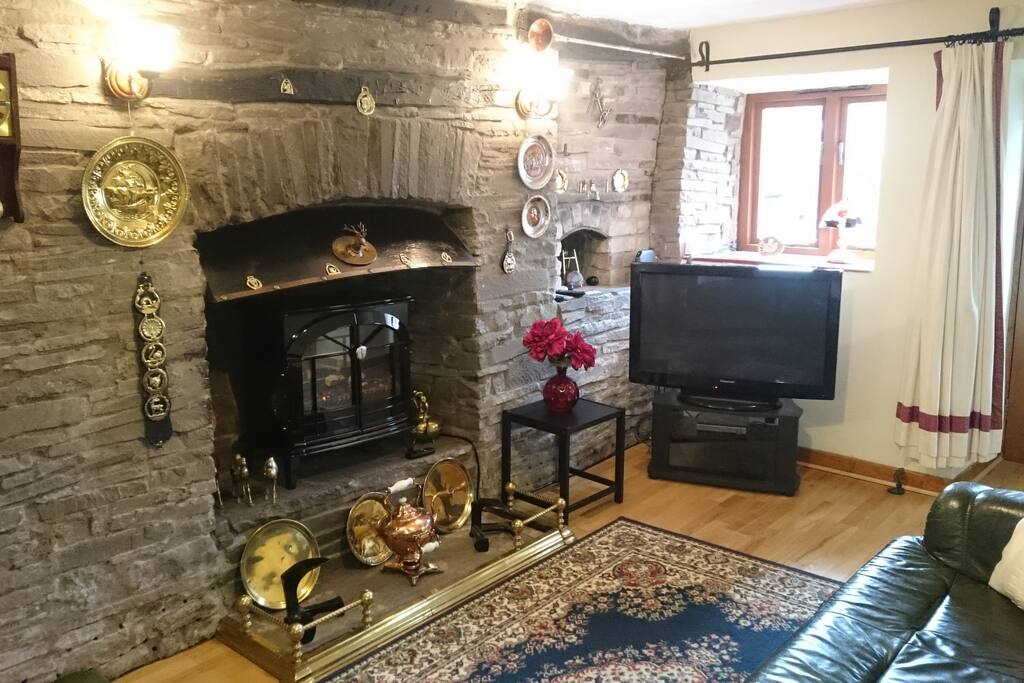 Lounge with leather suite and electric fire, also flat screen TV and DVD player.