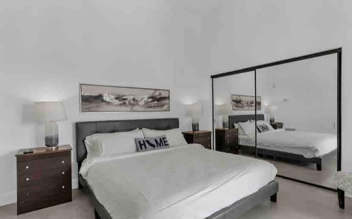 Bedroom 1: Cal King with full closet, access to the pool area and patio+ smart tv.
