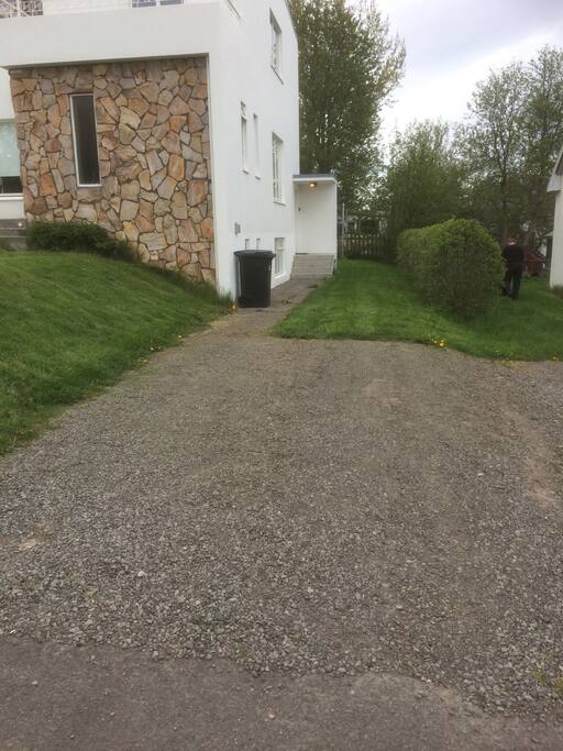 Private parking lot in front of the entrance.