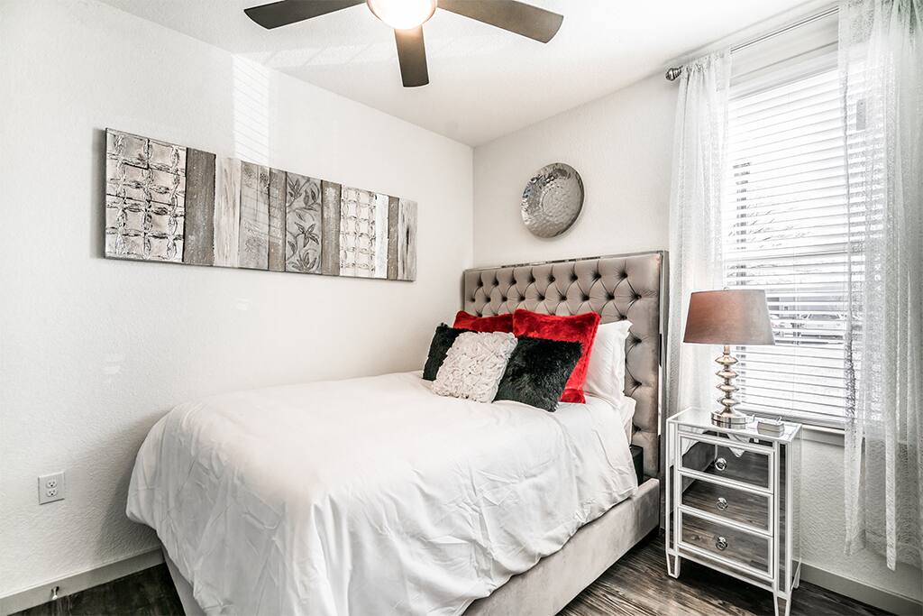 The secondary bedroom includes a queen-size bed.