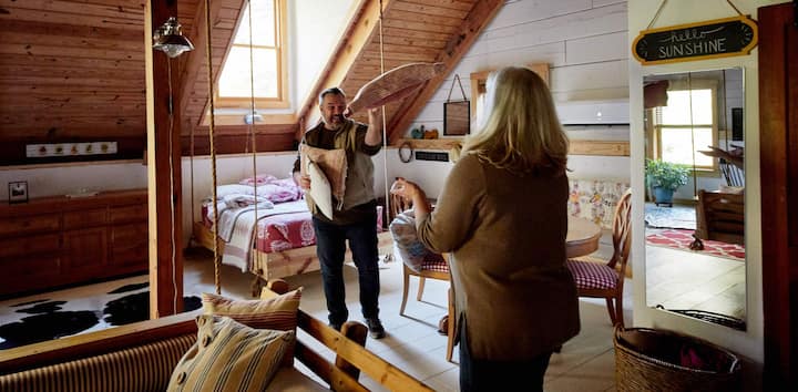 Two Hosts cleaning a room