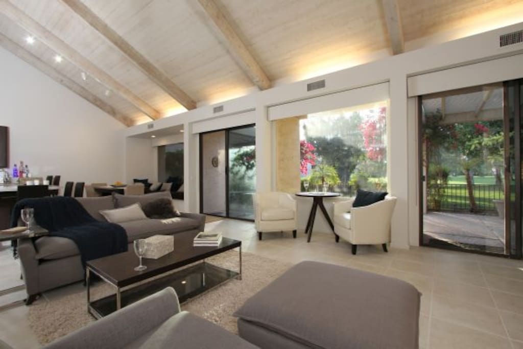 Catherdral ceiling leading to patio and golf course view