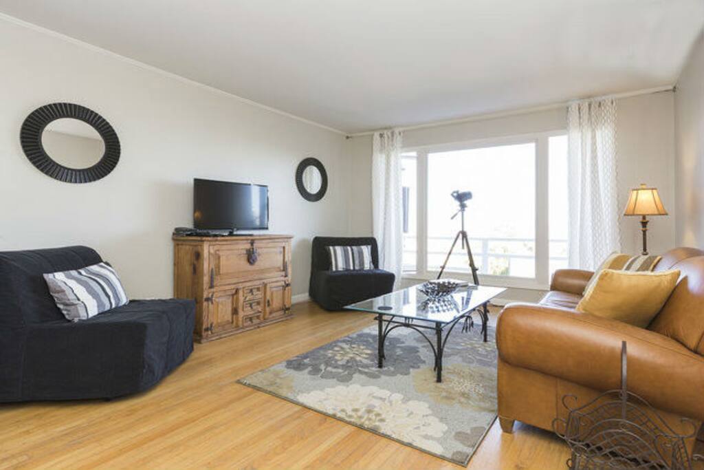 The living room gets nice natural light, good for reading