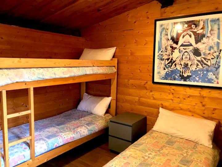 Front bedroom, single & bunkbeds /front room, single beds and bunk beds