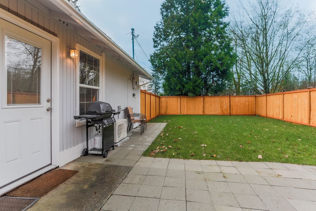 Fenced, stone patio and grill