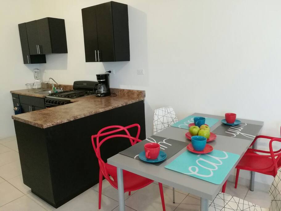 Kitchen fully equipped and nice dinner table