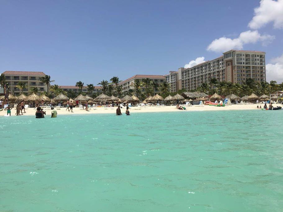 Clean, expansive beach with turquoise waters