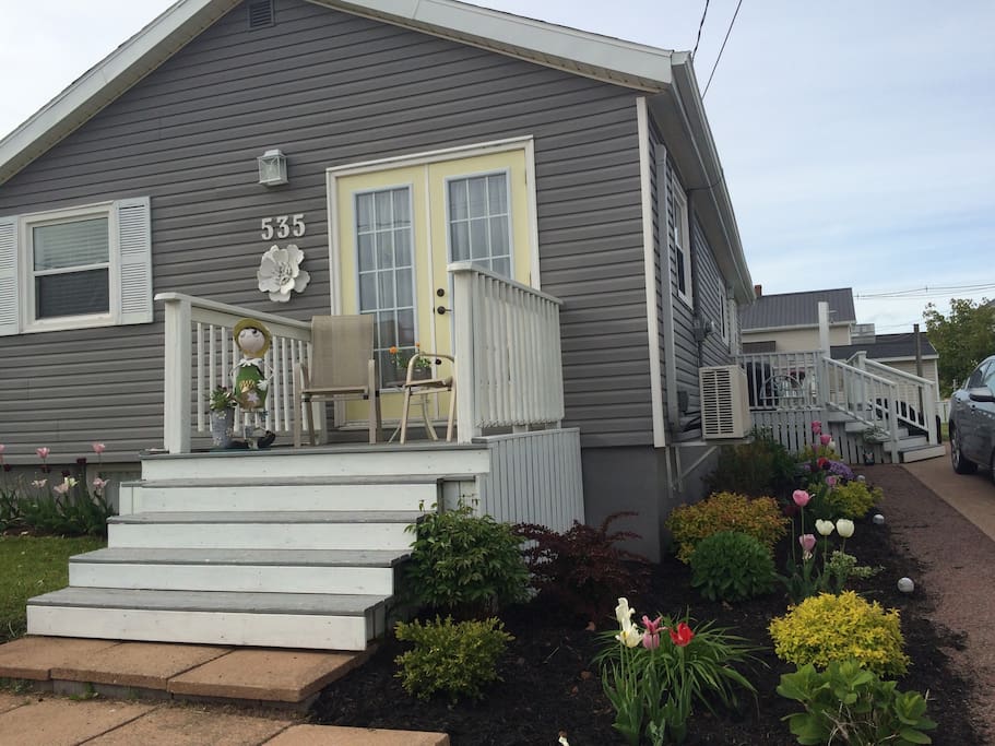 Home away from home ... lovely flower garden to enjoy and a large back yard!