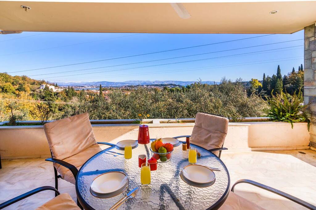 Outside sitting area on balcony with mountain view