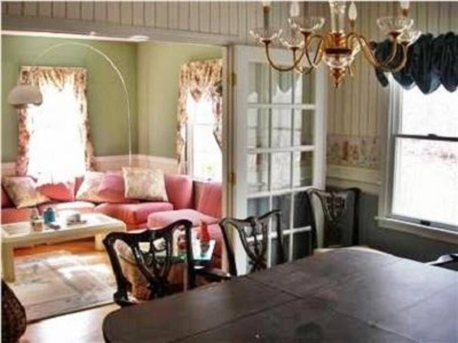 Gracious living room with french doors to dining room
