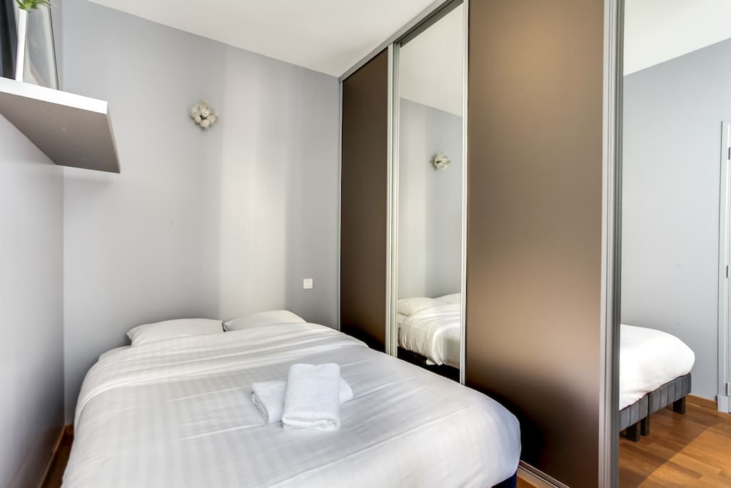 Bedroom with bed and hangers