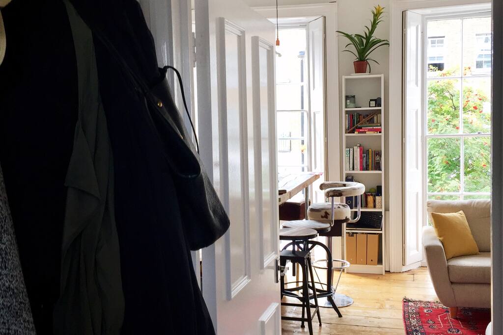 Entrance, with lounge and kitchen on left bathroom and bedroom on right, when walking into the apartment. Sleeper couch for two opposite the bay windows
