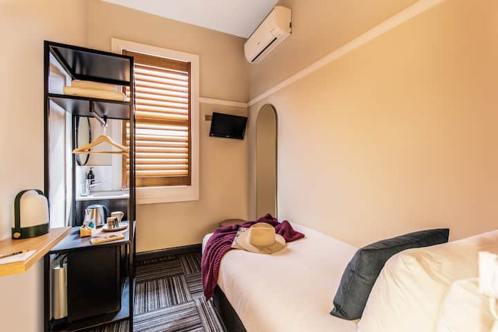 Compact Single Room with Cozy Pillow-topped Bed