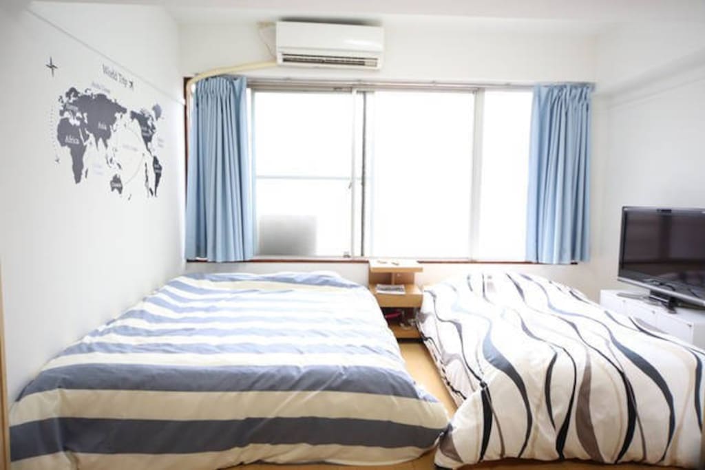 Bed room 2. There are 1 double bed and 1 single bed.
