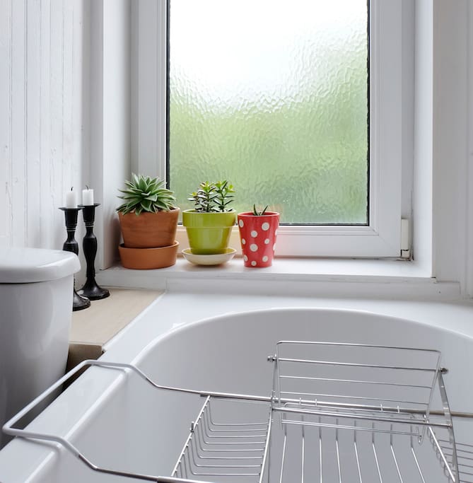 Bathtub comes complete with caddy and candles for a relaxing evening