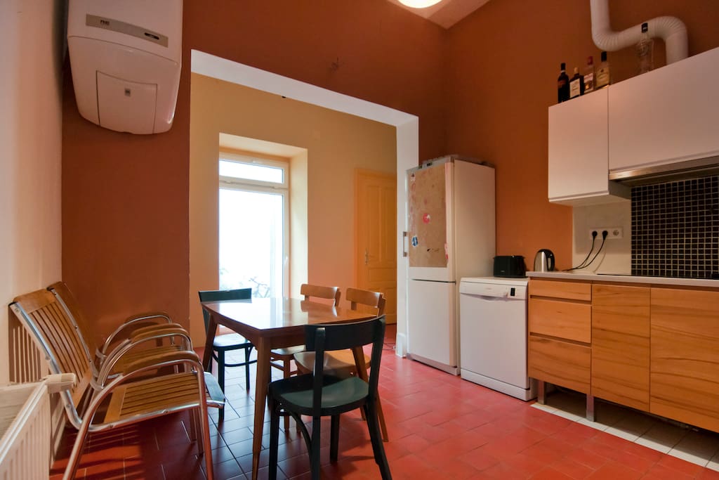 The kitchen with refridgerator, dishwasher, electric stove, kettle, toaster, and much more