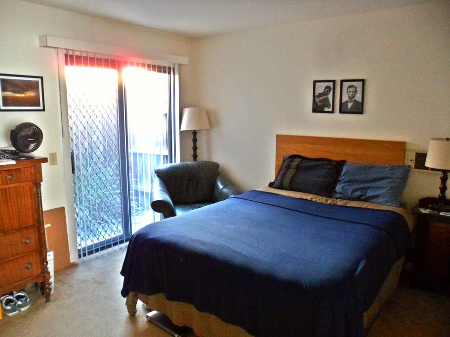 The bedroom. The sliding door leads out to your private patio.