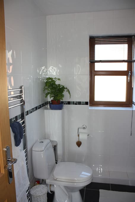 Spacious, clean en-suite with underfloor heating and heated towel rail.