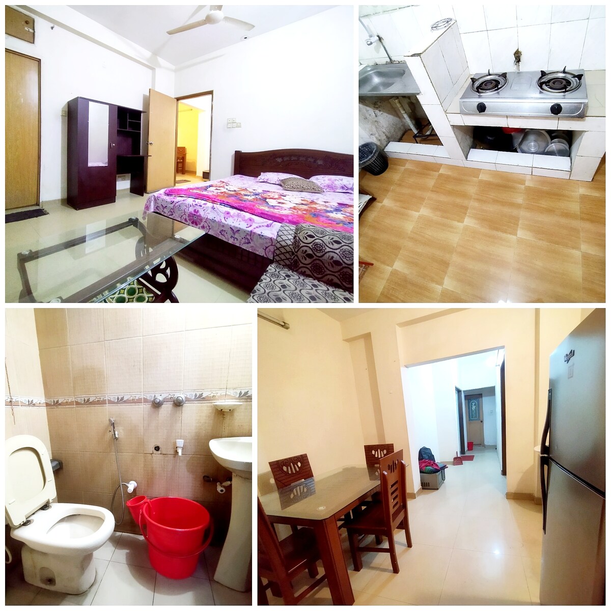 A spacious bedroom is equipped with a large bed adorned with colorful linens. The kitchen area features essential appliances, including a stove and sink. A dining area with a table and four chairs is visible, along with a bathroom showcasing basic fixtures.