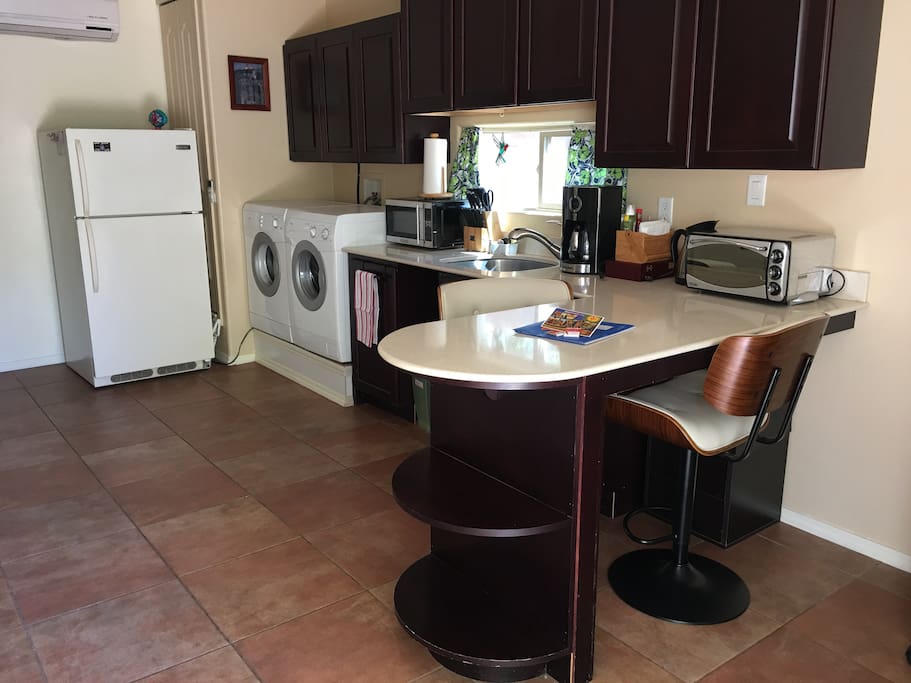 Kitchen with washer and dryer
