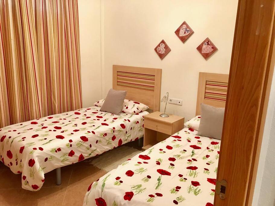 One of the three twin bedrooms