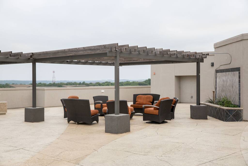 Fully furnished rooftop balcony with views of downtown