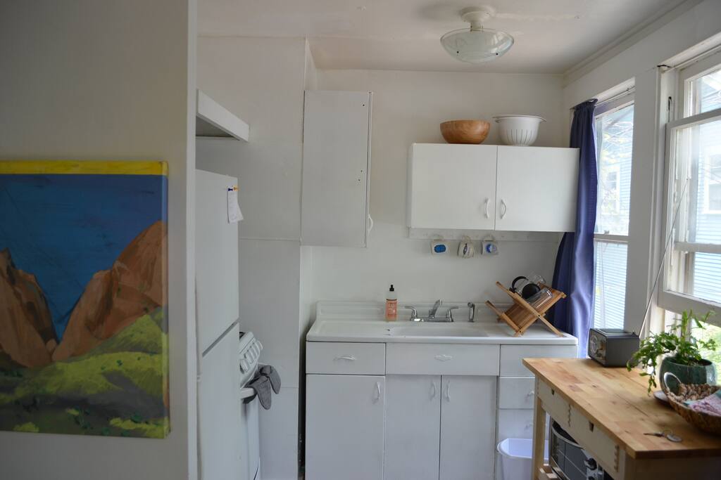The kitchen- with pots, pans, a french press, and all you need for cooking the basics. Anything you need? Ask the main house!