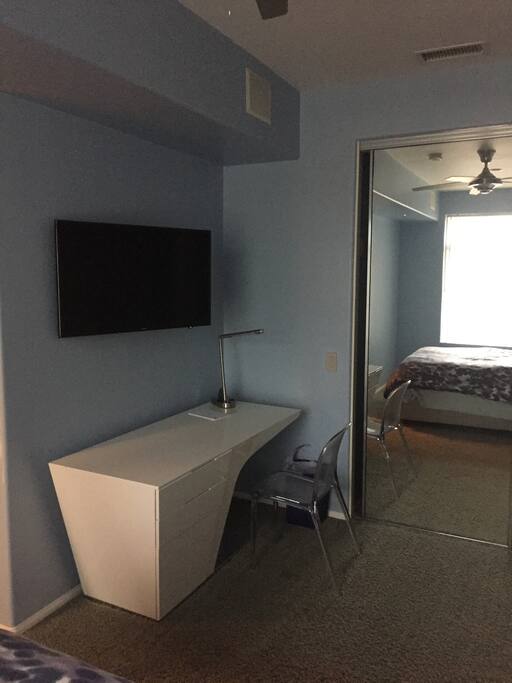 Spacious work area in bedroom with flat screen TV connected to local stations, Netflix, AppleTV and Amazon Prime, all wired to stereo speakers that also connect to Pandora and Spotify