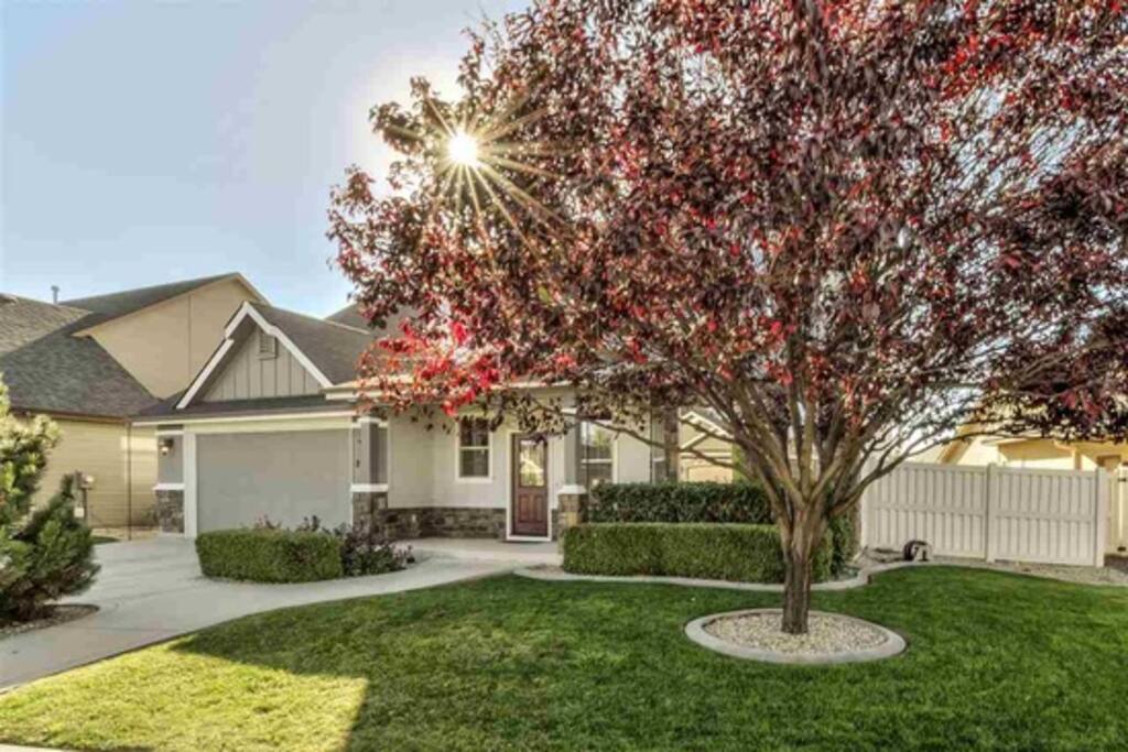 Side view of the home showcasing the walkway and front door.