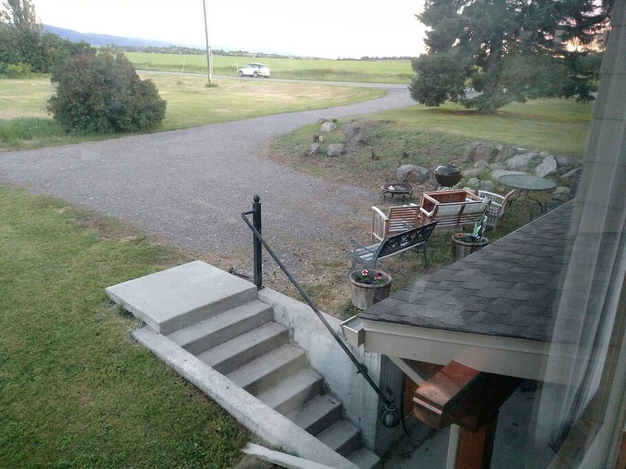 Looking back toward the road. Stairs going down into apartment entrance. Not handicap accessible.