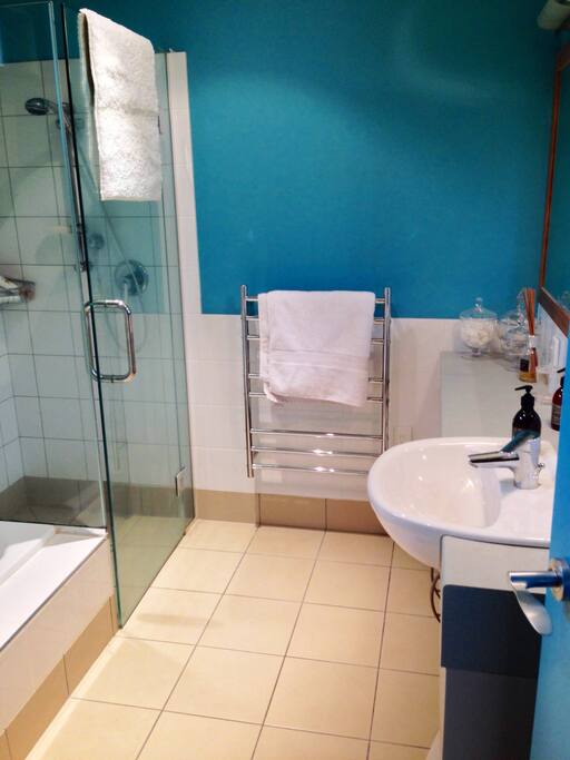 Private bathroom with shower and bath.