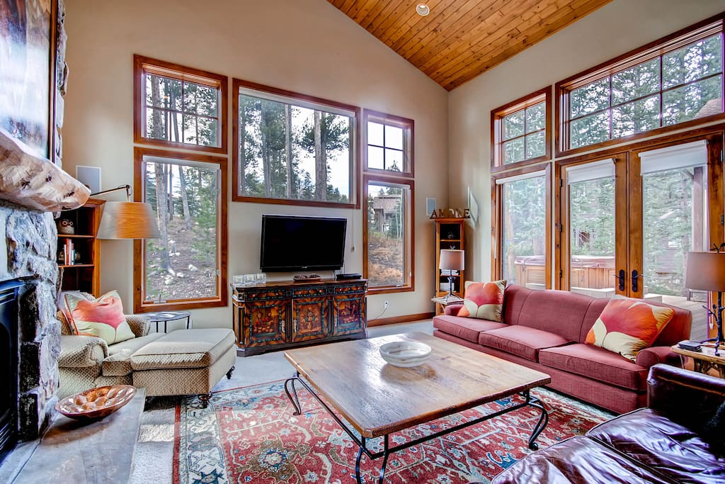 Great Room with lots of natural light, flat screen TV and gas fireplace - sits adjacent to Kitchen