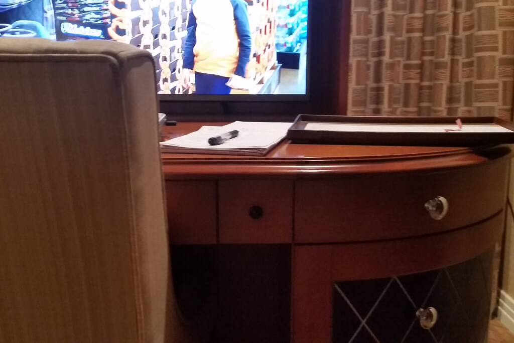 TV rises up from desk in Master Bedroom