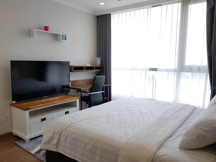 Master ensuite bedroom with 50" TV and great city view