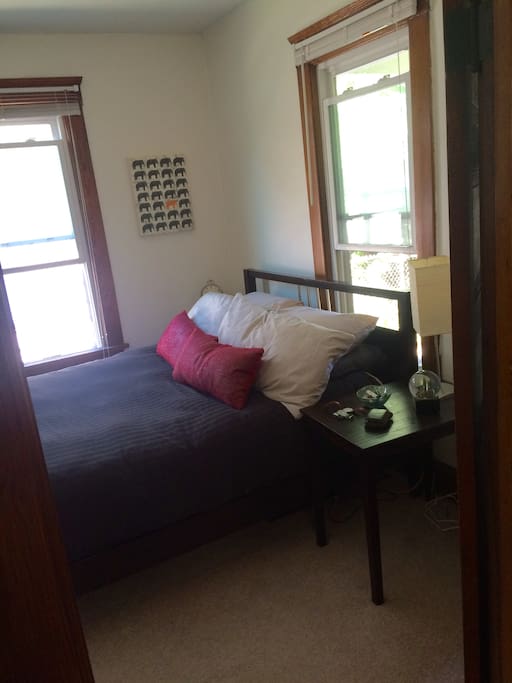 Queen sized bed in bedroom that comfortably sleeps 2