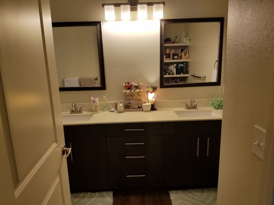 Attached master bath with dual vanity and spacious walk in shower.