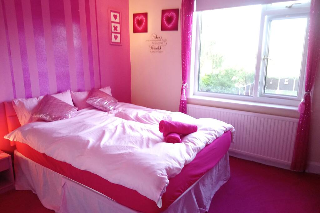 Luscious Pink Back Bedroom with King-size Bed.