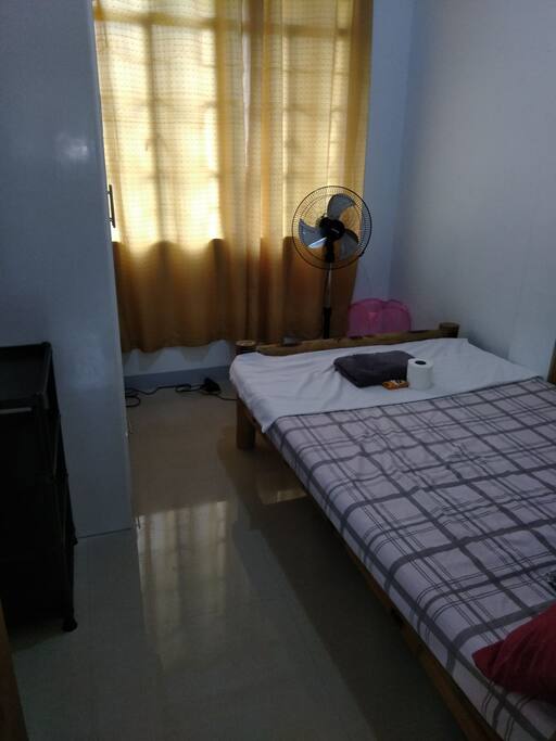 Fan room with cabinet, hangers, corner shelf stand, and a hamper for your soiled clothes.