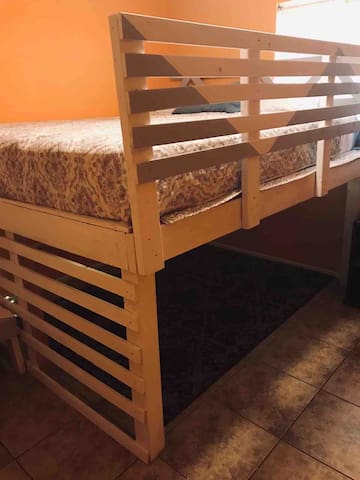 Private room with a king size loft bed.