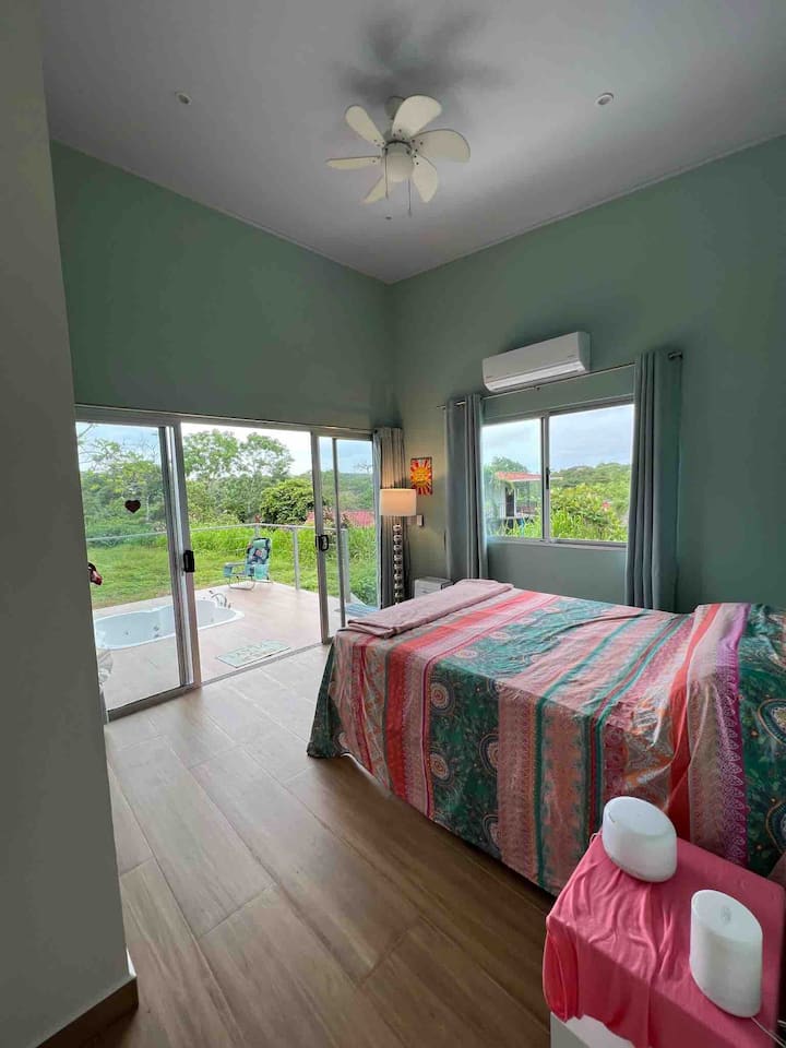 Master bedroom has queen bed and white sheets if you're not into the bright colors!