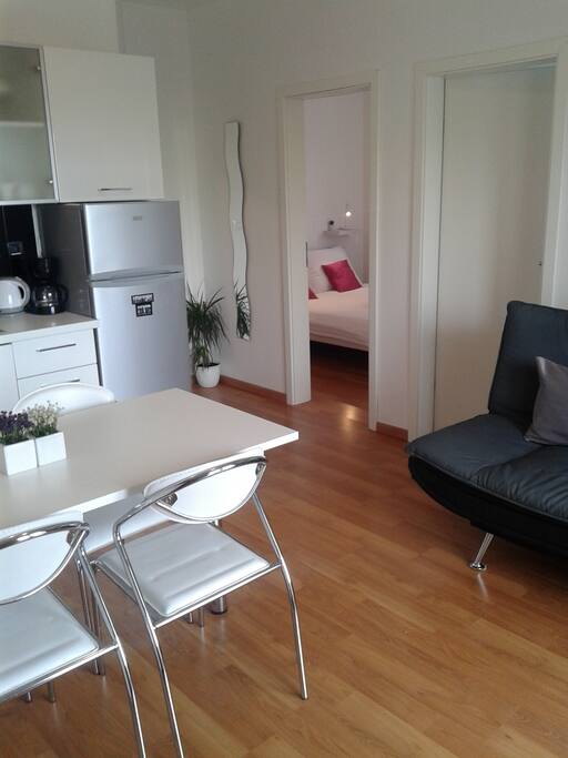 Kitchen, dining area and sofa