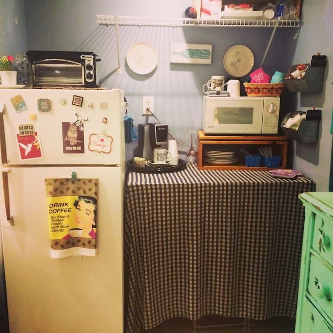 Kitchenette complete with Keurig, toaster oven, microwave, and refrigerator.