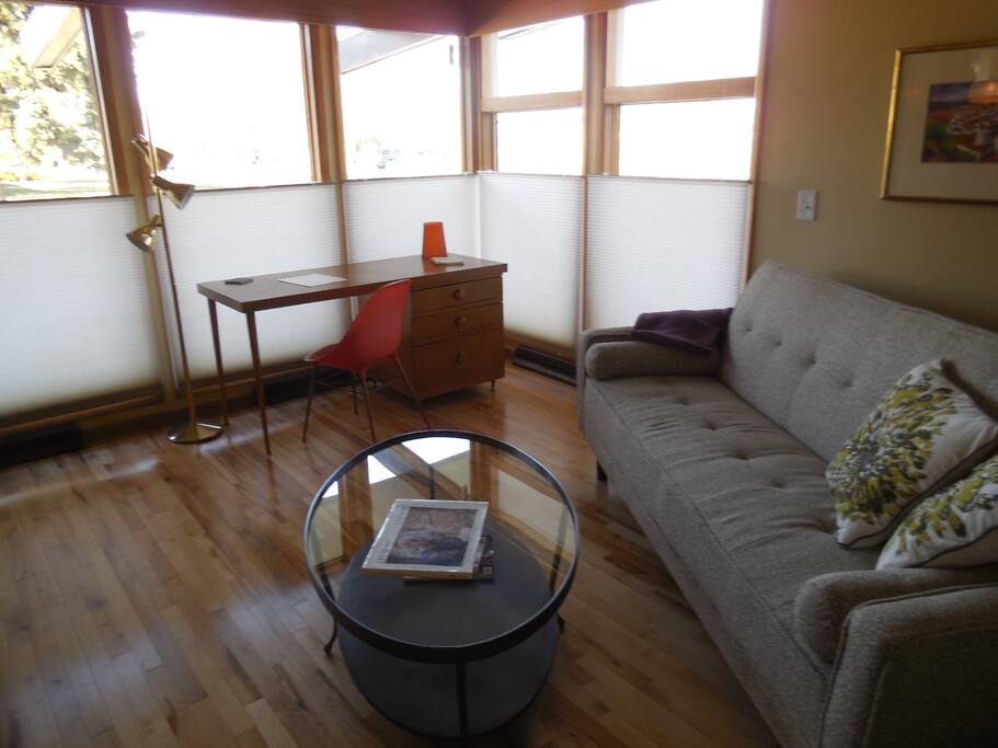 Main living space next to entry with futon for additional sleeping.