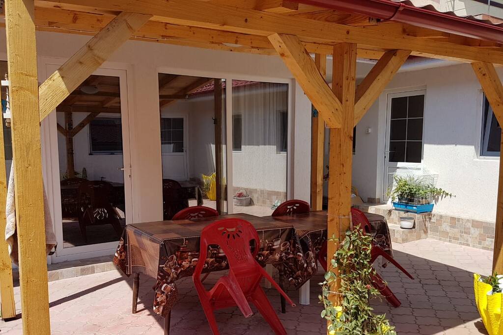 Shared terrace in the yard. There is one more terrace with a BBQ available in the opposite side of the house.
