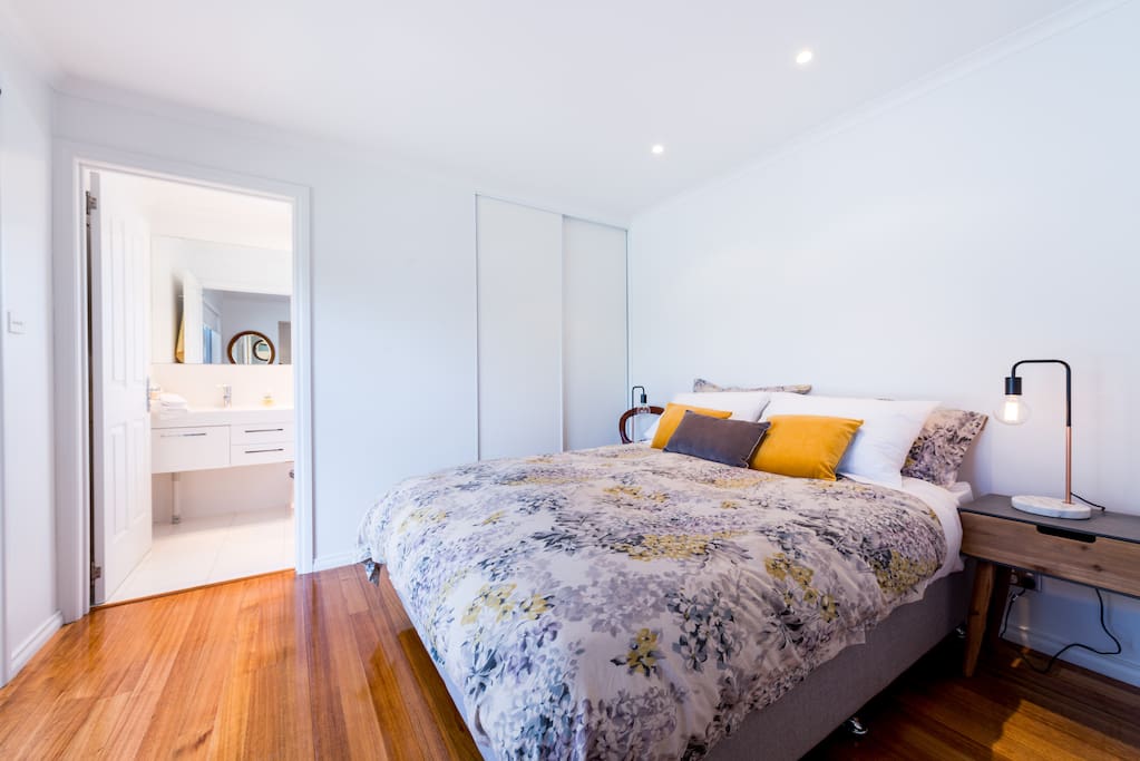 Bedroom featuring queen size bed and built in wardrobe