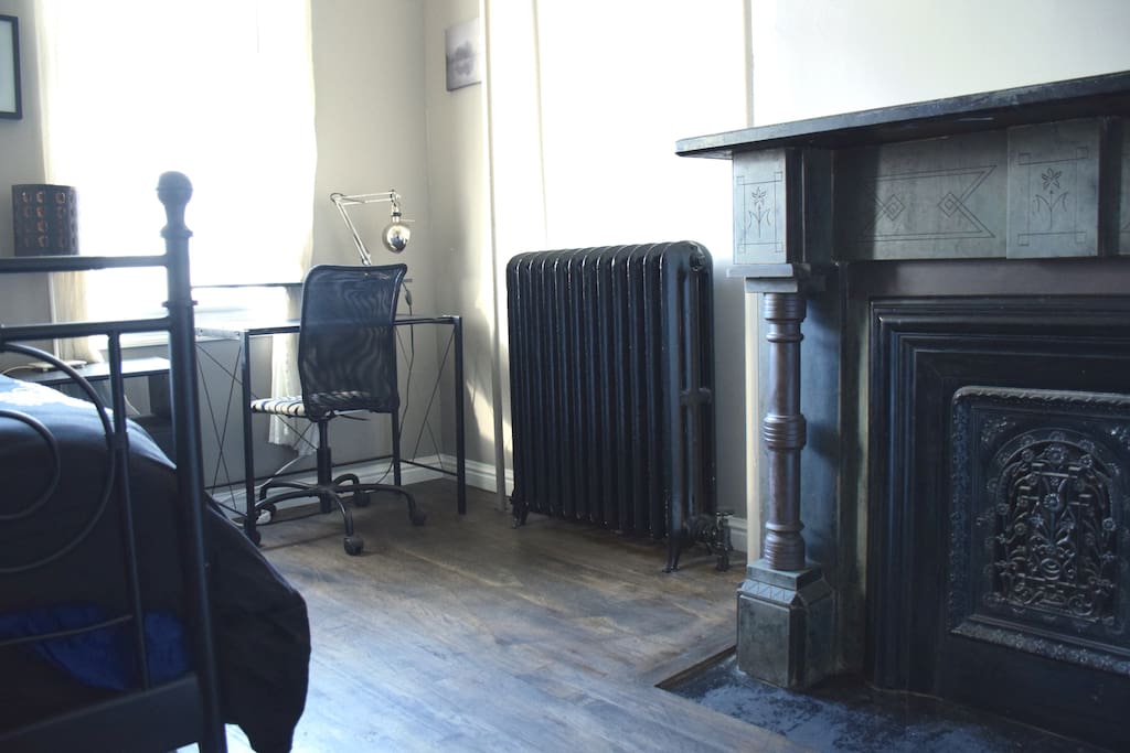 The desk and fireplace.