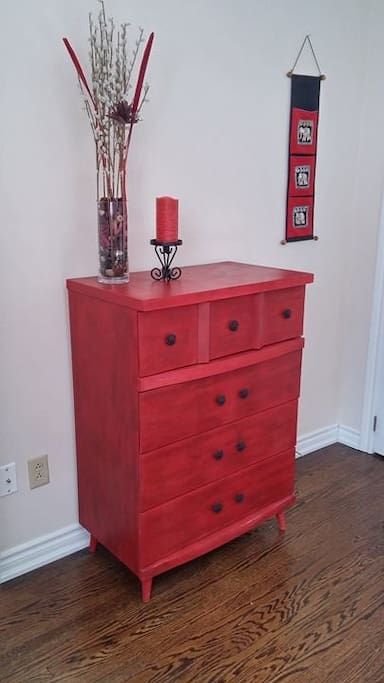 This dresser has just been redone in red and black