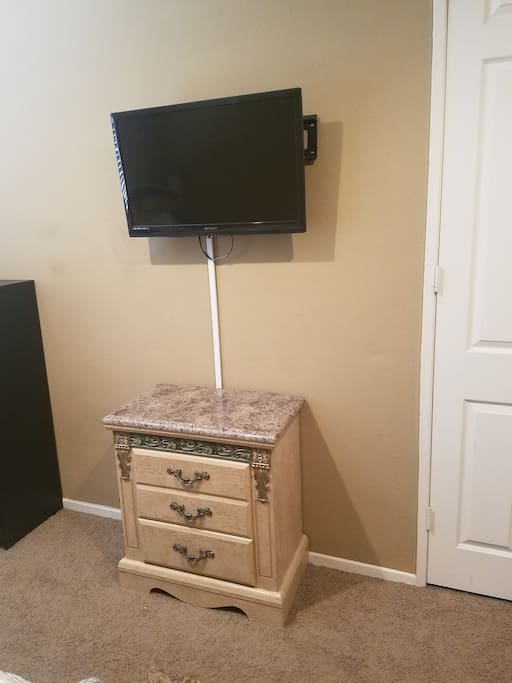 tv with cable and drawers below for storage