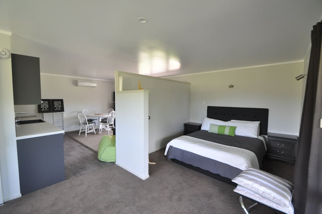 Our studio unit with a privacy wall for the Queen bed