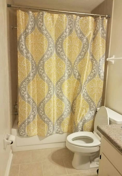 Full bathroom with tub and shower